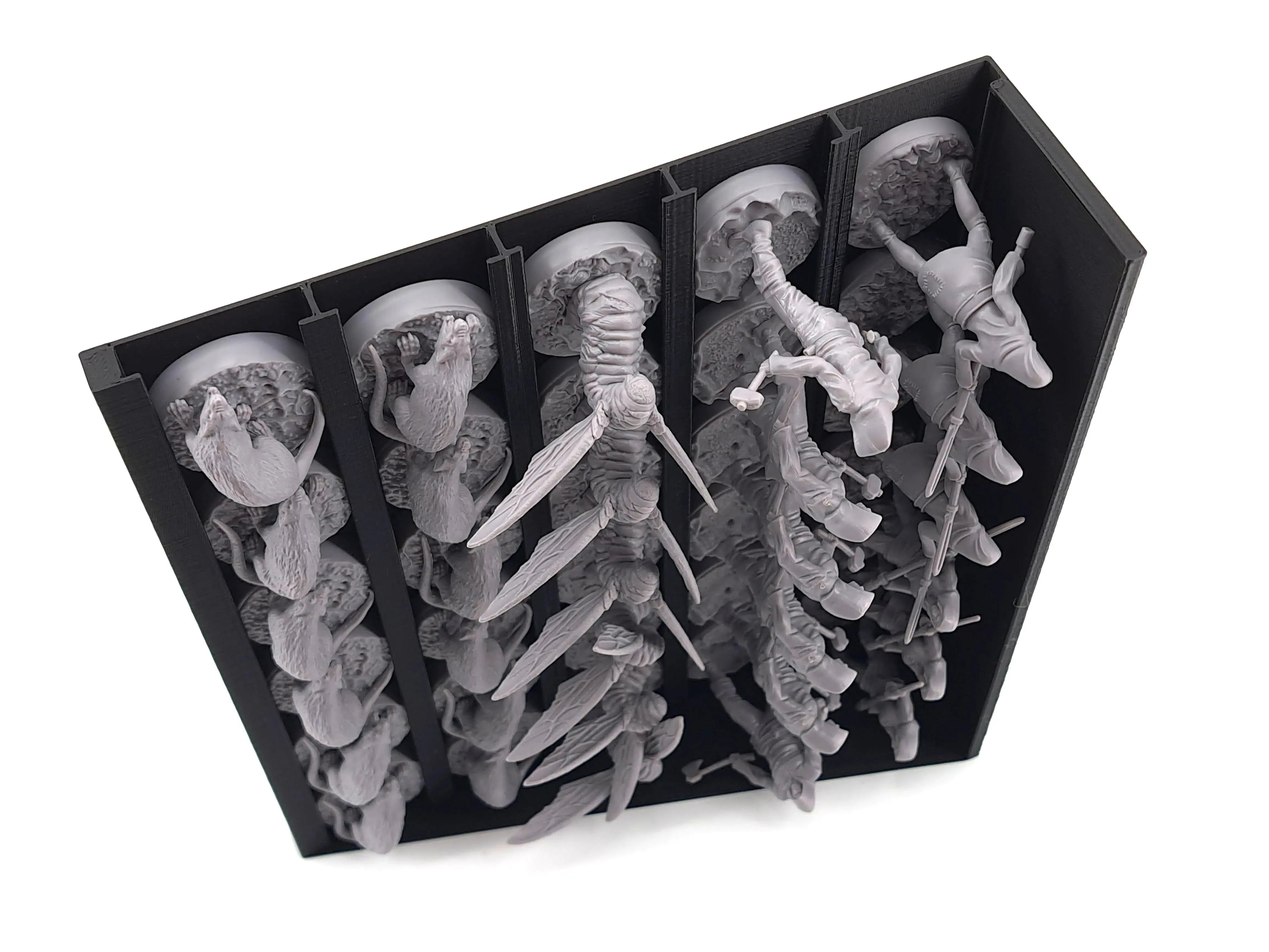 Black 3D-printed miniature holder tray by Tinkering Paws, storing multiple Oathsworn miniatures vertically in separated slots. The grey minis fit securely into the upright compartments, providing space-saving storage, fast set-up, easy clean-up, and a protective organiser upgrade for board-game expansions and 3D-print inserts.