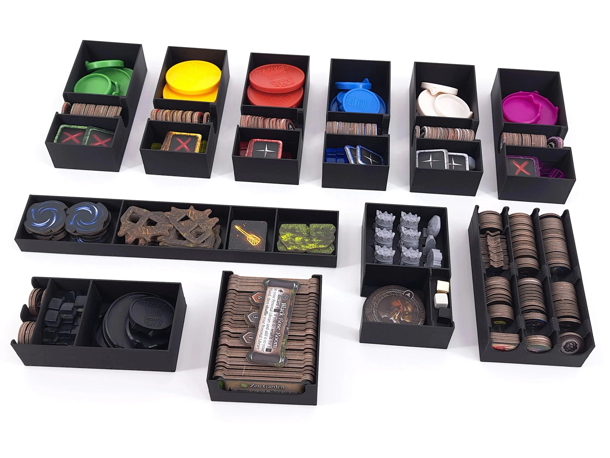 Black 3D printed board game organizer inserts with separate trays for tokens, coins, and game components