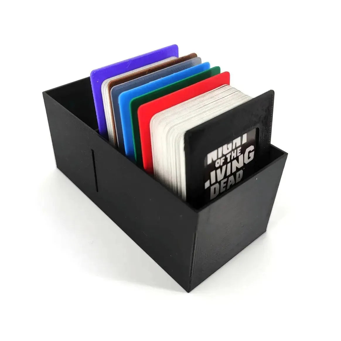 A black card storage box containing a deck of Night of the Living Dead game cards with colorful plastic dividers for organization.