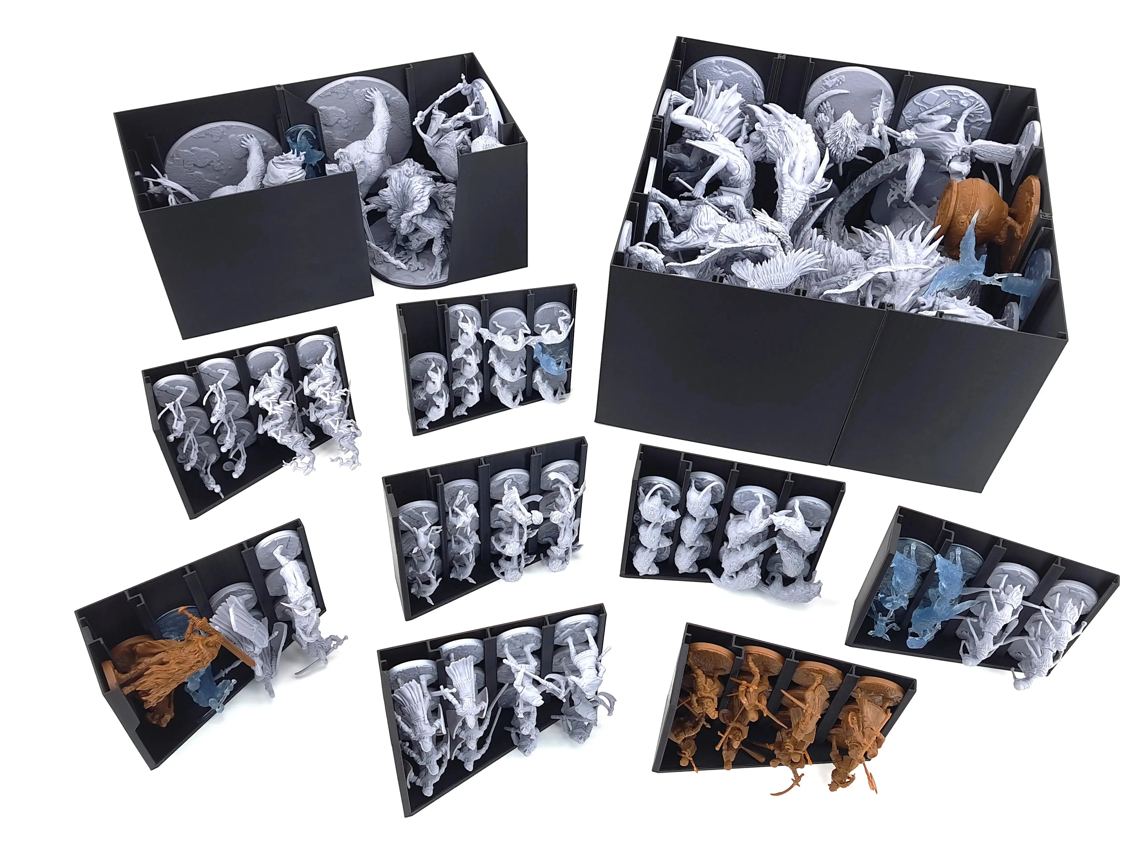 Overview of the Elden Ring board game miniature storage insert as digital STL files by Tinkering Paws. The image shows multiple black 3D-printed organizer trays arranged on a white background, each holding large Elden Ring miniatures such as bosses, monsters, and enemies. The set includes deep storage boxes for oversized miniatures and vertical racks that securely hold individual figures upright, preventing damage and reducing setup time. This is a 3D printable organizer system designed to fit inside the El