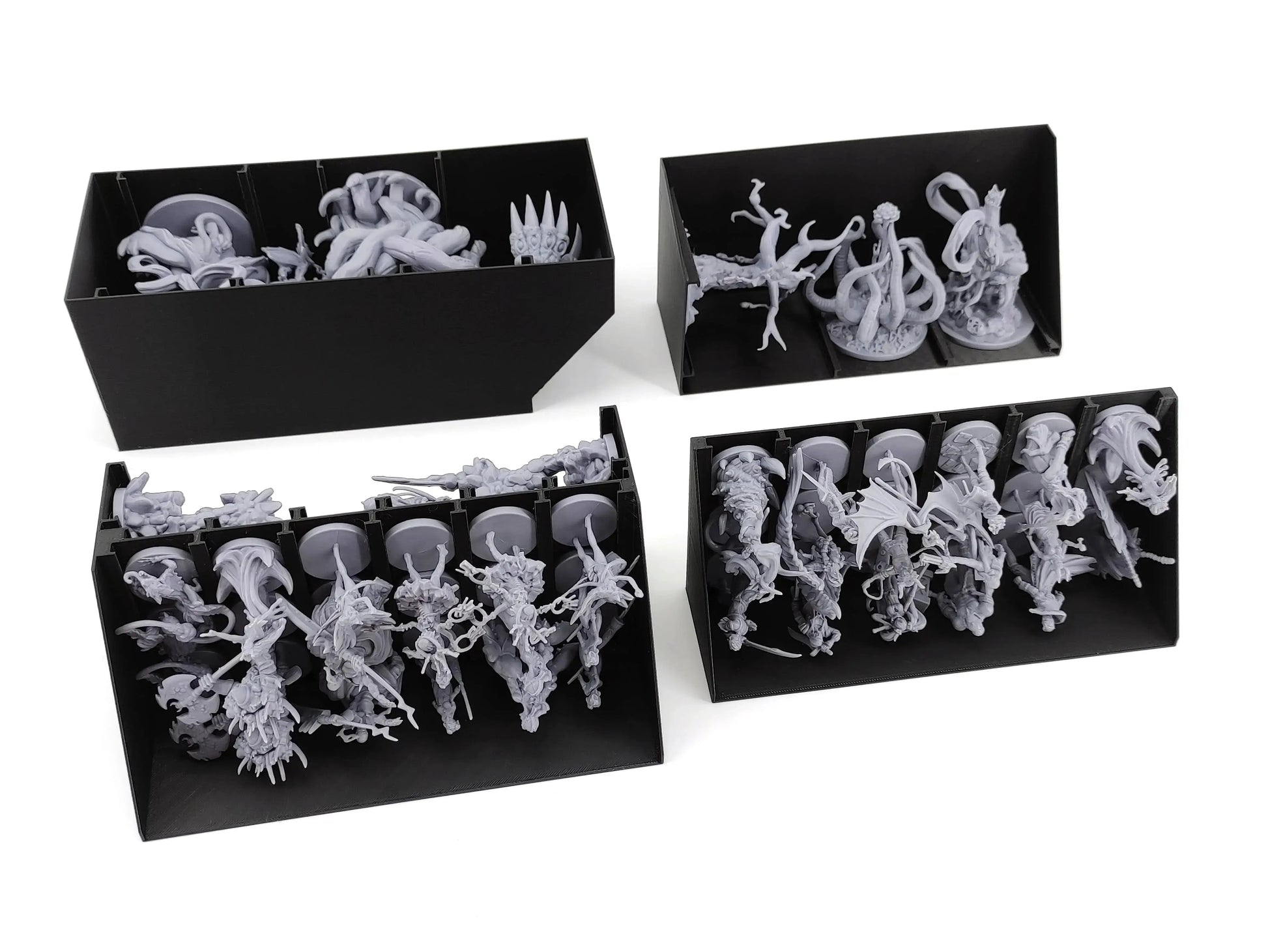Specialized black 3D-printed miniature trays for Middara Act 1, holding various large and small grey plastic game figures securely in a vertical storage system.