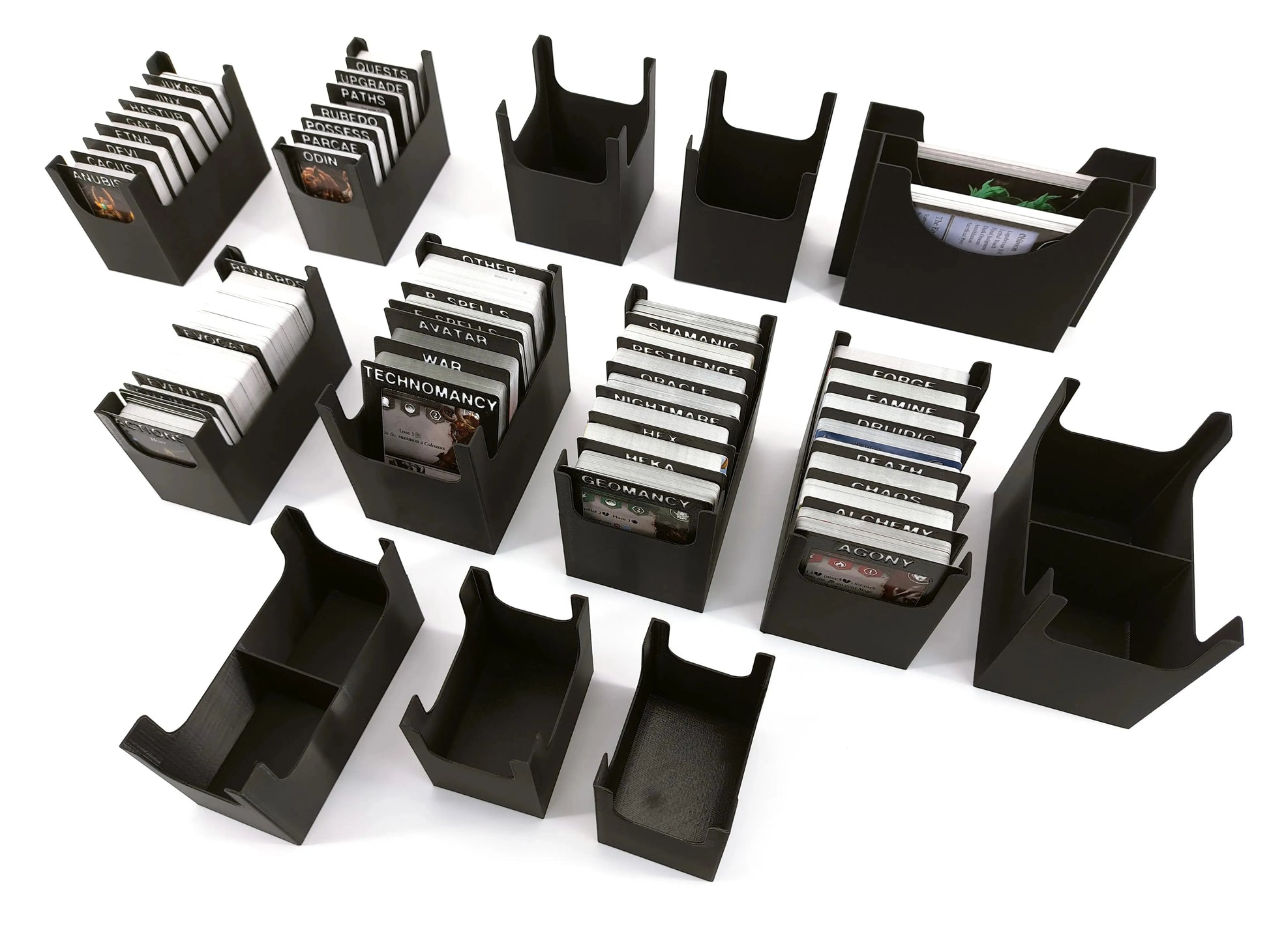 Set of modular 3D-printed card holder inserts by Tinkering Paws, shown with various card decks and empty holders. Designed for organizing board game cards. Digital STL files only, no physical product included.