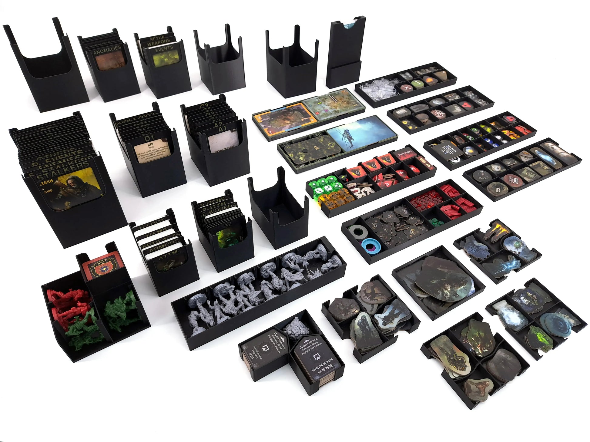 Detailed view of the STALKER Board Game Insert and Organizer. All individual, removable trays for tokens, sleeved cards, miniature holders, and game components are neatly arranged on a white background.