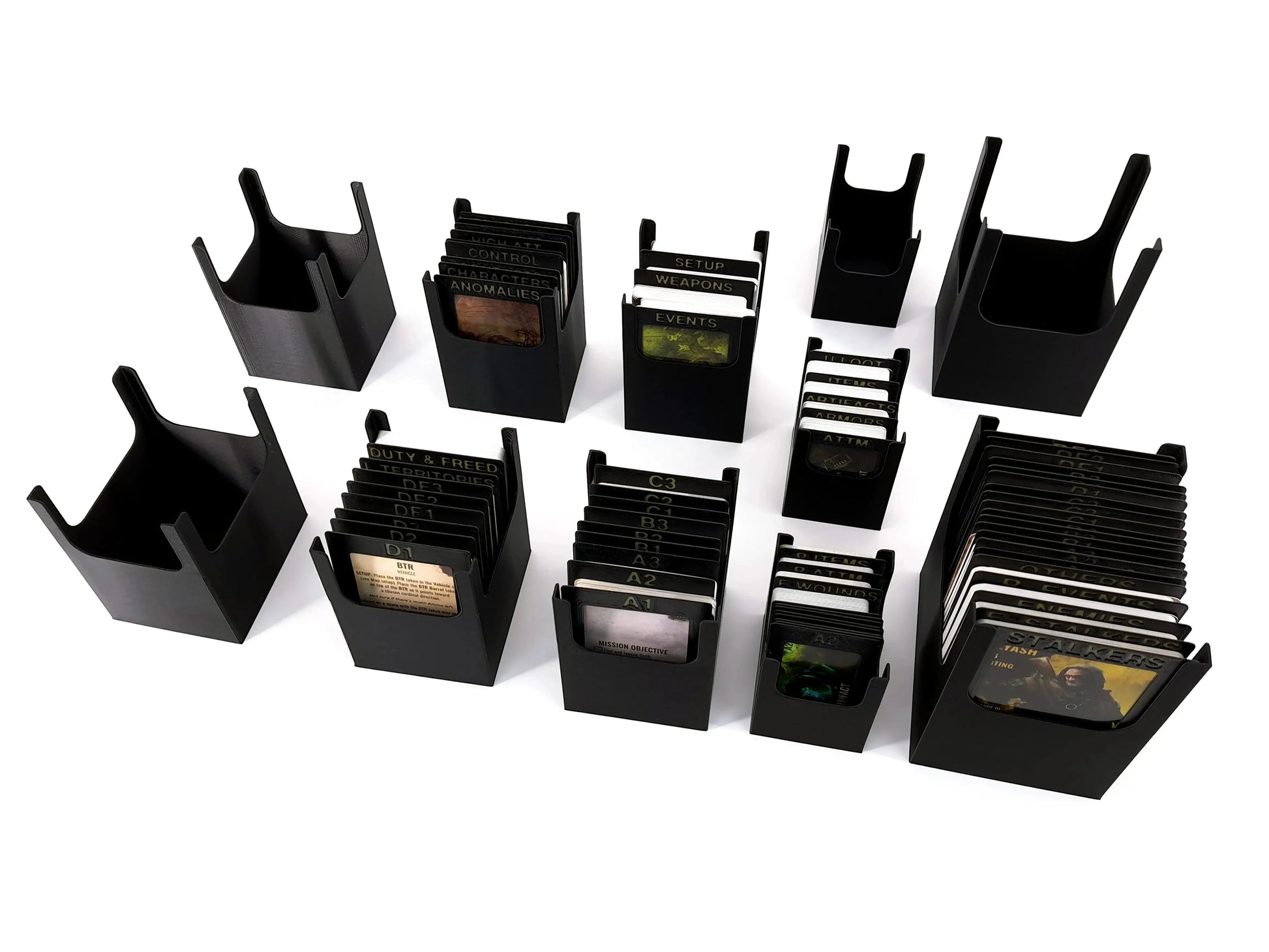 Modular card holders from the STALKER: The Board Game Organizer, clearly showing storage for sleeved cards and separated decks like Duty & Freedom and Event cards.